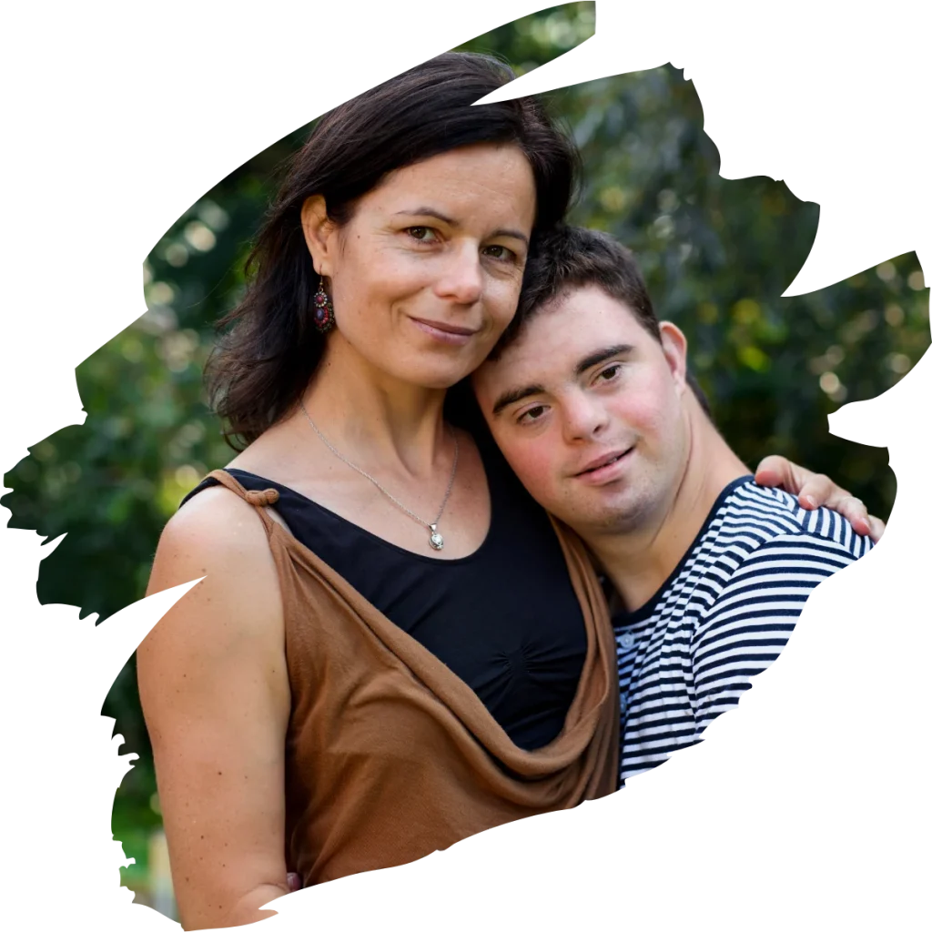 Mum and disabled man hugging and looking at camera